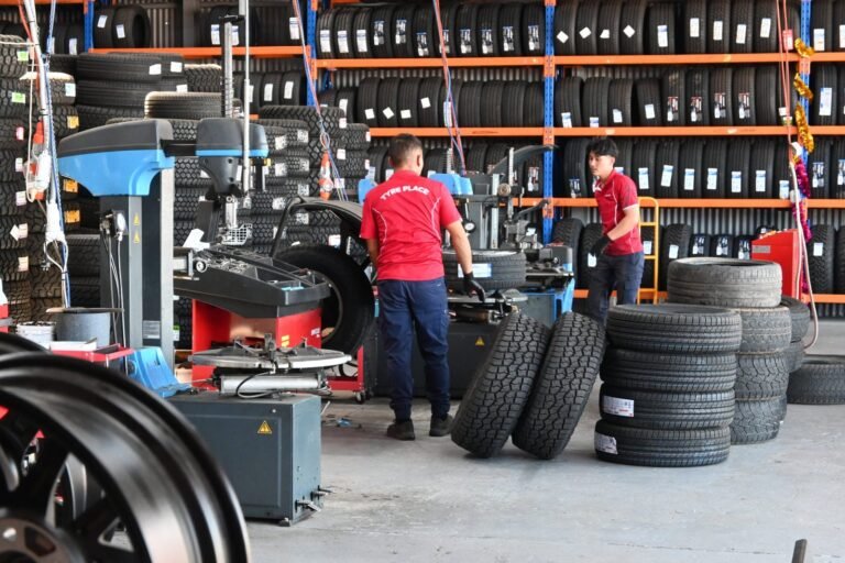 TyrePlace staff working on wheels in the workshop